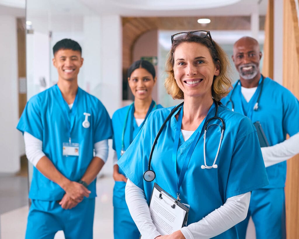 healthcare professionals smiling in complete uniforms